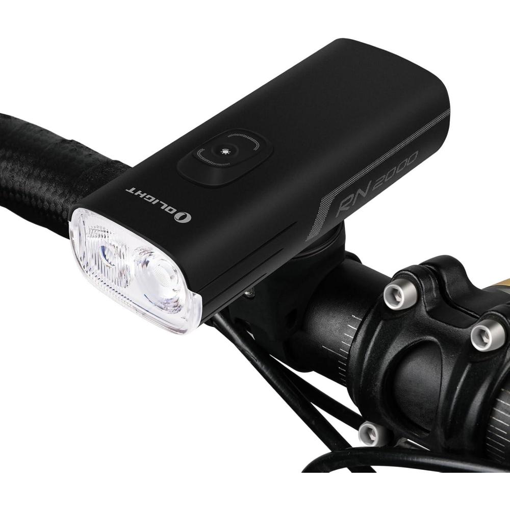 imageOLIGHT RN 2000 LED Rechargeable Bike Light 2000 Lumens and 557ft Max Throw Waterproof Bicycle Headlight with SpotampampFlood Beams Remote Control TypeC and Smart Sensor for Mountain and Urban Riding